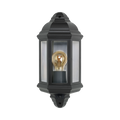 A black outdoor wall lantern light fixture with a clear glass front and a visible warm-toned Edison bulb inside, shown against a plain white background.