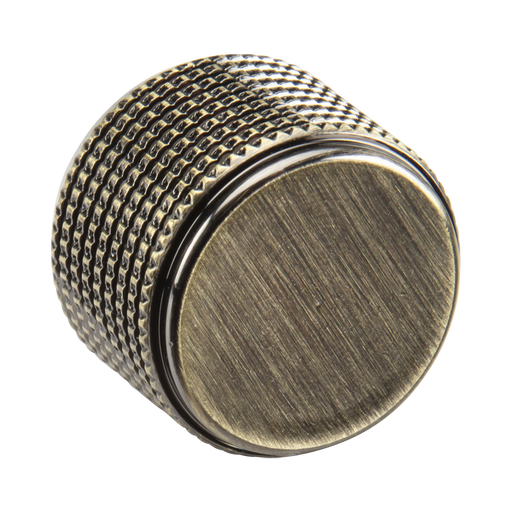 Metal knob with textured surface on a white background