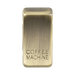 Brass rectangular object with 'COFFEE MACHINE' engraving on a white background