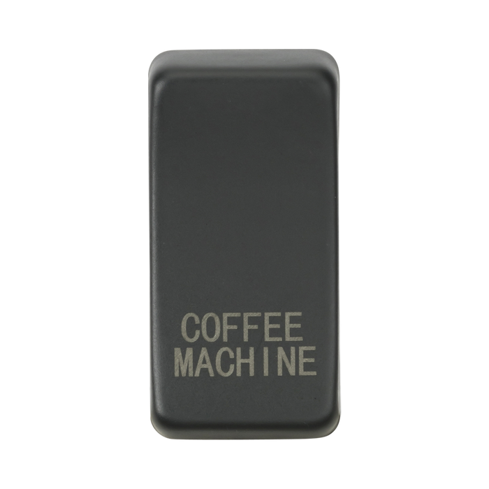 Anthracite rectangular object with 'COFFEE MACHINE' engraving on a white background