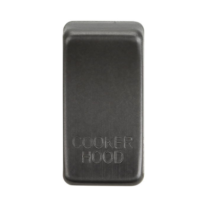Smoked bronze rectangular object with 'Cooker Hood' engraving on a white background