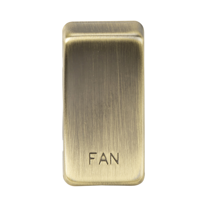 Brass rectangular switch with 'FAN' engraving on a white background