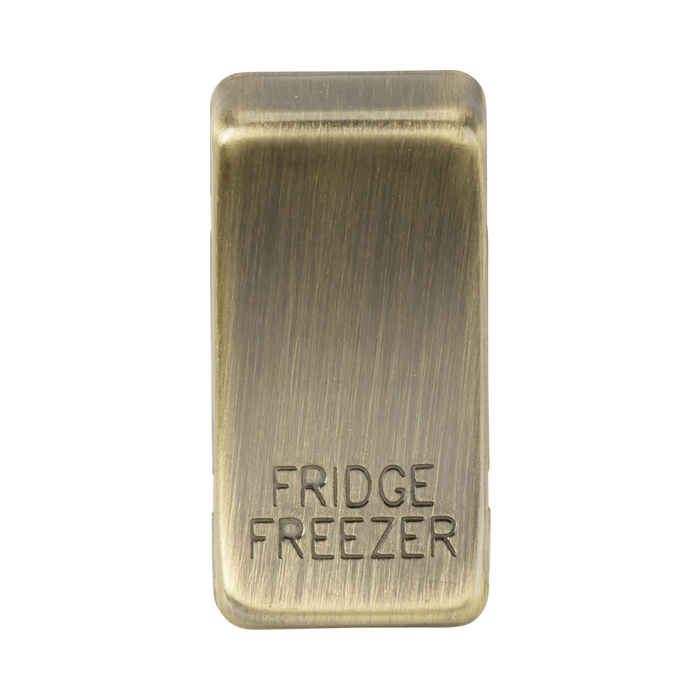 Rectangular brass sign with 'FRIDGE FREEZER' text on a white background
