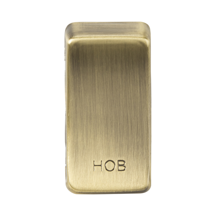 Brass rectangular object with 'HOB' branding on a white background