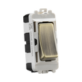 Light switch with metallic rocker on a white background