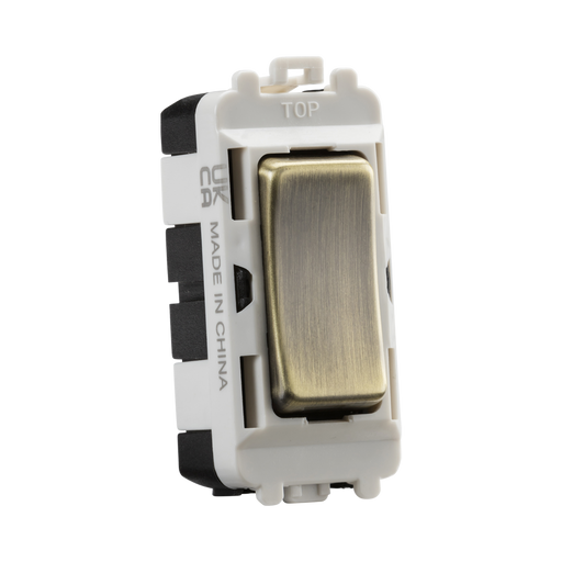 Light switch with metallic rocker on a white background