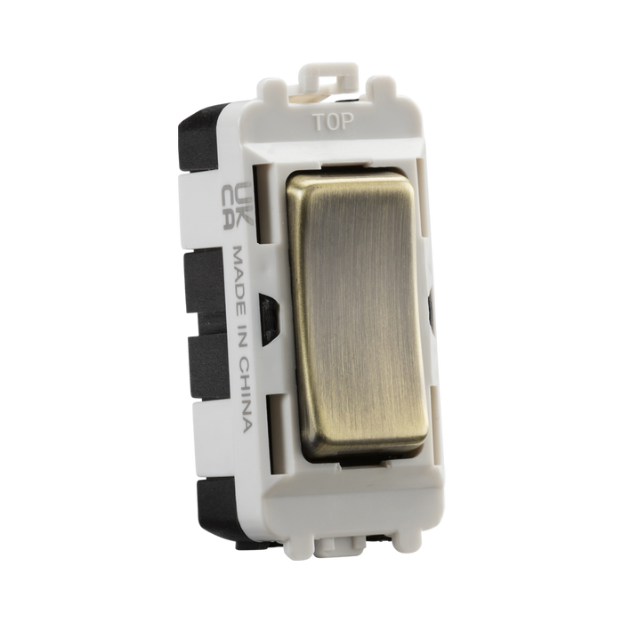 Light switch with metallic rocker on a white background