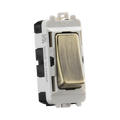 Light switch with metallic rocker on a white background