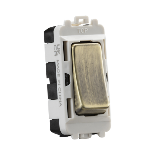 Light switch with metallic rocker on a white background