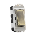 White and brass switch on a white background