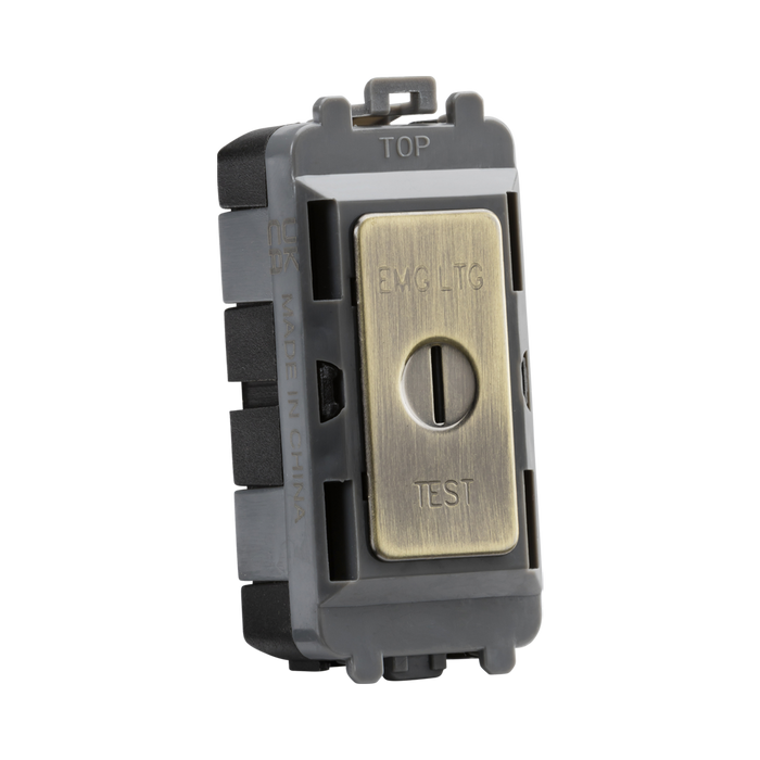 Brass electrical switch with 'EMG LTC' and 'TEST' labels on a white background