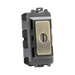 Brass electrical switch with 'EMG LTC' and 'TEST' labels on a white background