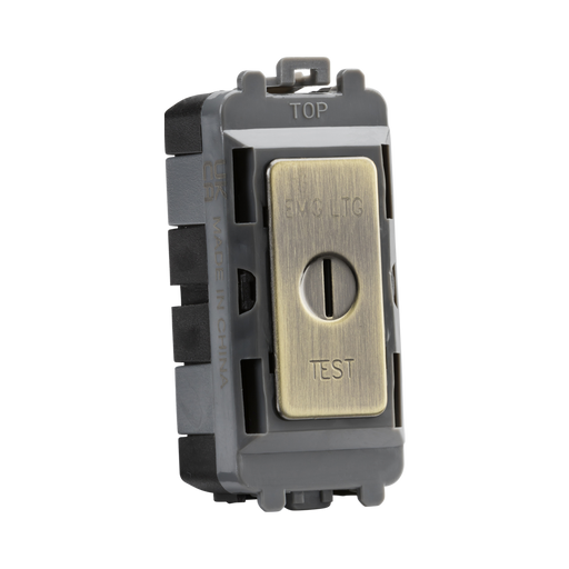 Brass electrical switch with 'EMG LTC' and 'TEST' labels on a white background