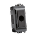 Black plastic component with a central hole on a white background