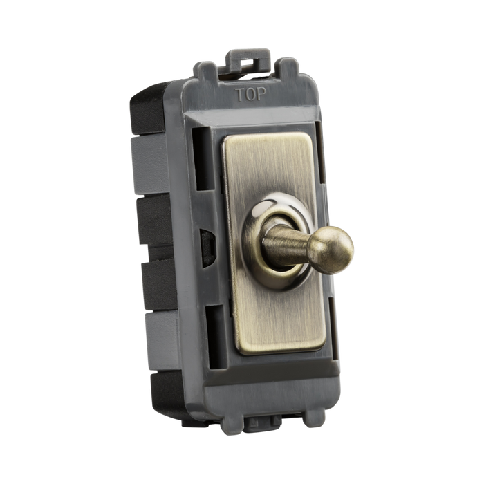 Toggle switch with brass-colored toggle on a white background