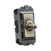 Toggle switch with brass-colored toggle on a white background