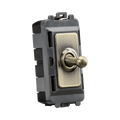 Toggle switch with brass-colored toggle on a white background