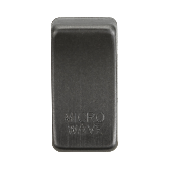 Rectangular smoked bronze object with 'MICROWAVE' engraving on a white background