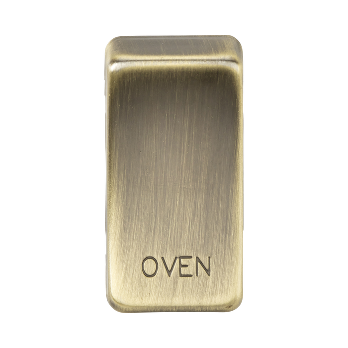 Brass oven door handle with 'OVEN' engraving on a white background