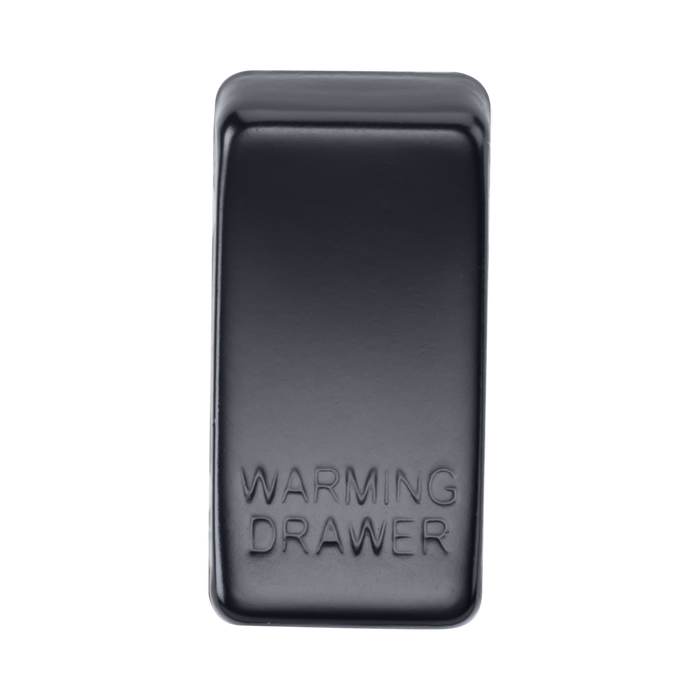 Black rectangular object with 'Warming Drawer' engraving on a white background