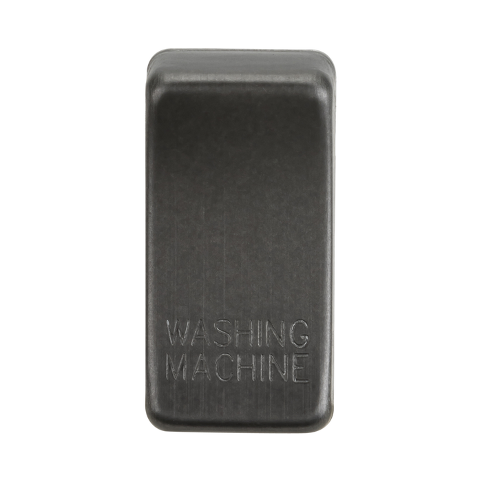 Rectangular smoked bronze object with 'Washing Machine' engraving on a white background
