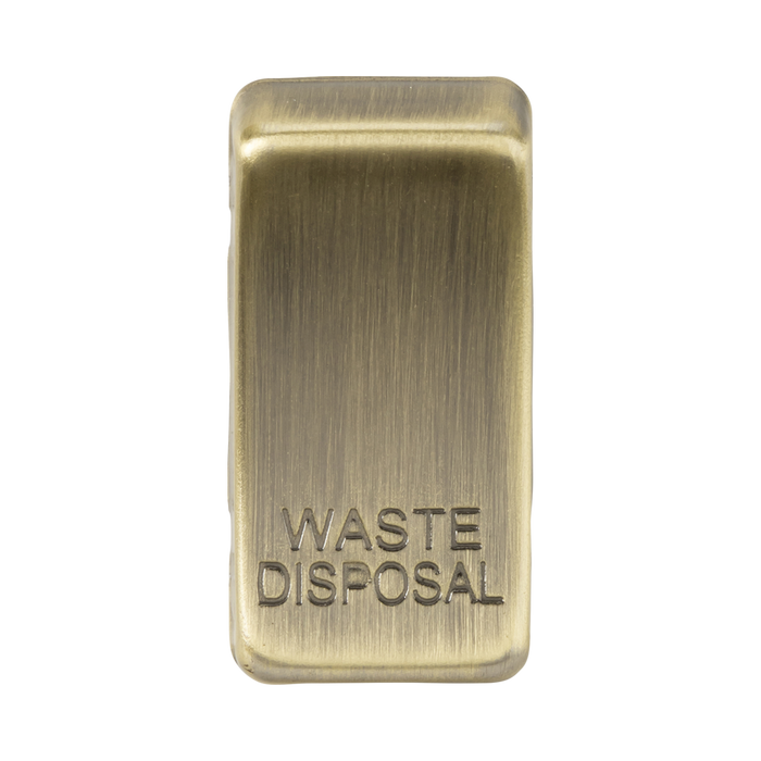 Rectangular brass waste disposal button on a white background