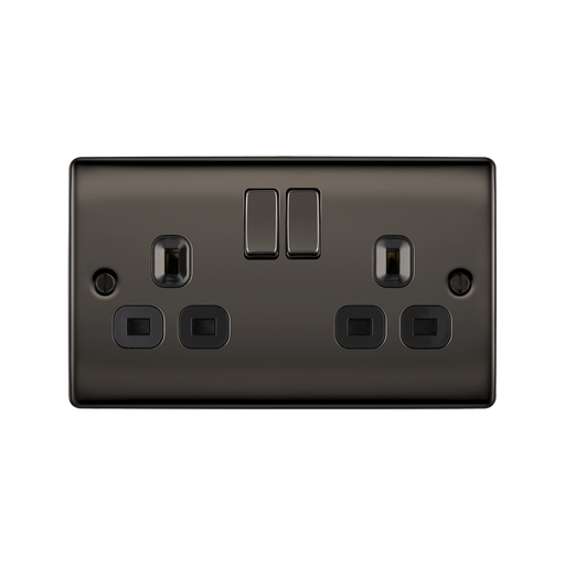 Black electrical socket with two plug sockets and two switches on a white background