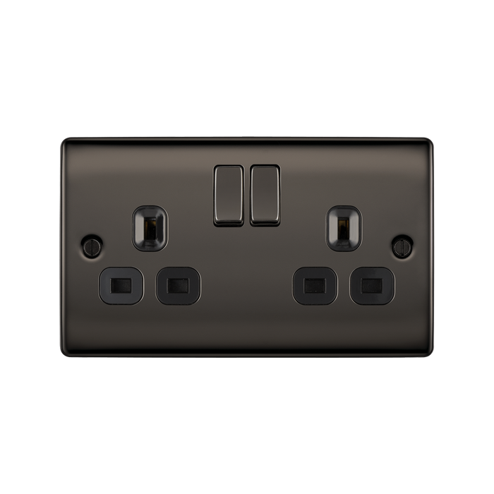 Black electrical socket with two plug sockets and two switches on a white background
