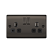 Black electrical socket with two plug sockets and two switches on a white background