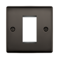 Dark bronze metal wall plate with a central cutout on a white background
