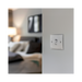 Metallic light switch on a white background bedroom setting
