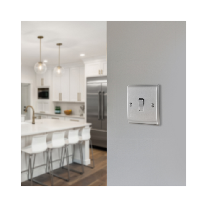 Metallic light switch on a white background kitchen setting