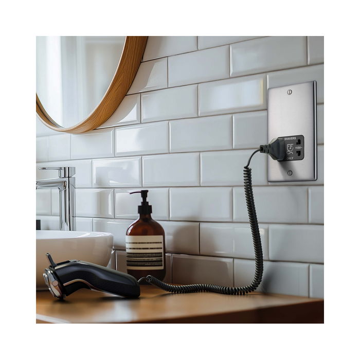 Metallic wall socket with shaver outlet on a white background bathroom setting 