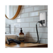 Metallic wall socket with shaver outlet on a white background bathroom setting 
