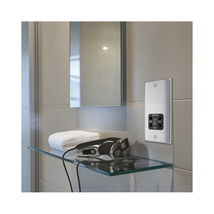 Metallic wall socket with shaver outlet on a white background bathroom setting 