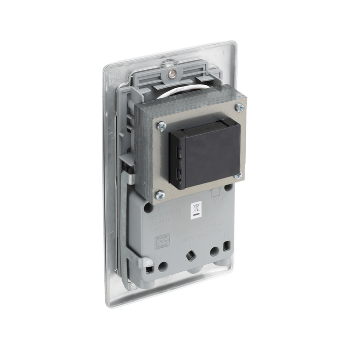 Metallic wall outlet with shaver socket label on a white background back