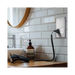 Metallic wall socket with shaver outlet label on a white background bathroom setting