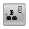 Metallic electrical socket with black inserts on a white background