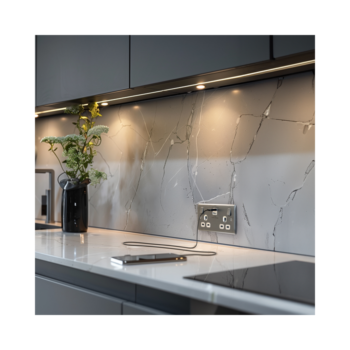 Silver electrical socket with multiple outlets and USB ports on a white background kitchen setting