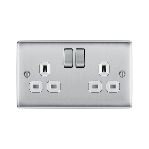 Metallic light switch with multiple sockets and switches on a white background