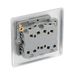Metallic light switch panel with three toggle switches on a white background back