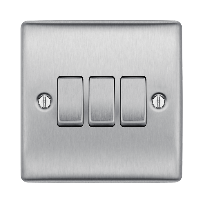 Metallic light switch panel with three toggle switches on a white background