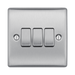 Metallic light switch panel with three toggle switches on a white background