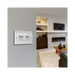 Metallic four-switch panel on a white background living room setting