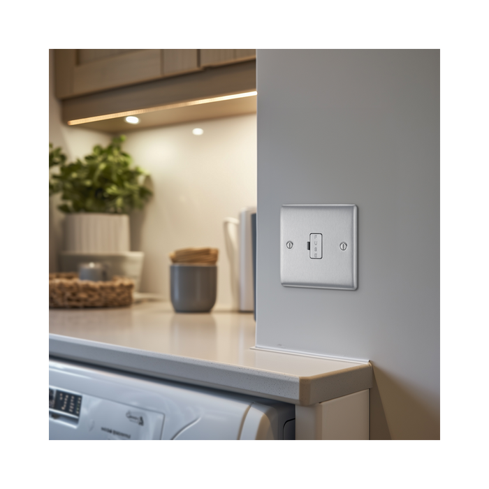 Metallic light switch on a white background kitchen setting