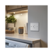 Metallic light switch on a white background kitchen setting