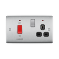 Metallic electrical switch with red button and black sockets on a white background
