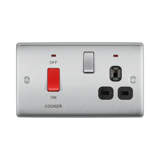 Metallic electrical switch with red button and black sockets on a white background