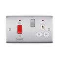 Metallic electrical switch with red button and multiple sockets on a white background