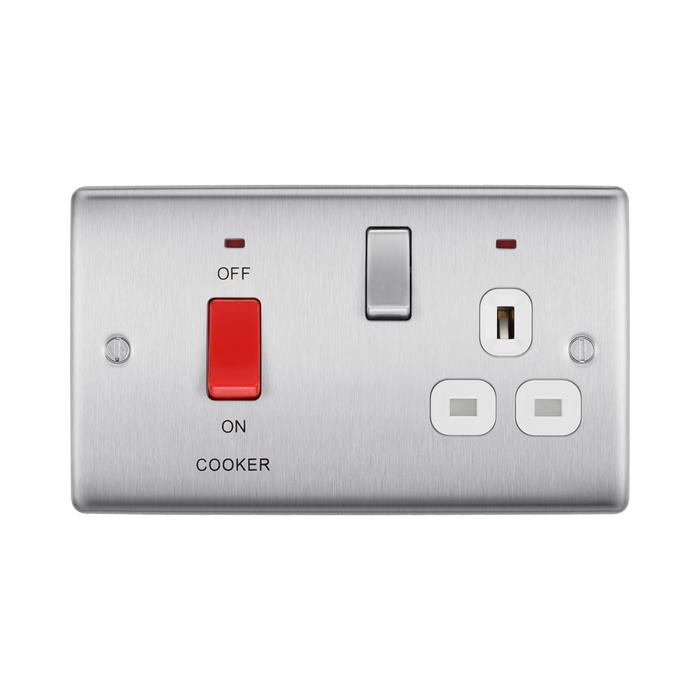 Metallic electrical switch with red button and multiple sockets on a white background
